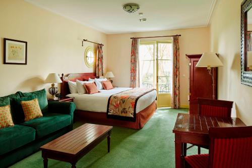 A bed or beds in a room at Marriott's Village d'Ile-de-France