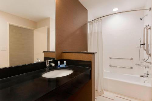 a bathroom with a sink and a shower at Fairfield Inn & Suites by Marriott Pittsburgh Airport/Robinson Township in Robinson Township