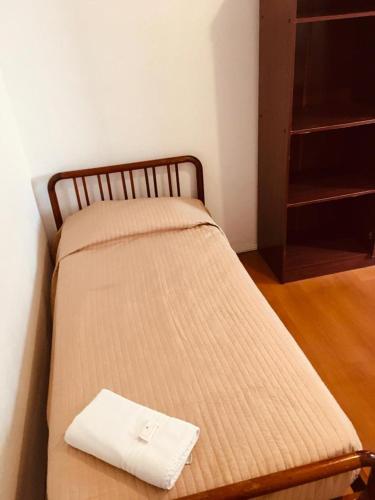 Ένα ή περισσότερα κρεβάτια σε δωμάτιο στο Porto Rei Residence Hotel