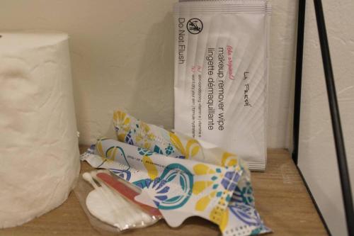 a bag of toilet paper and a roll of paper at Agave Tiny House at Cactus Flower-HOT TUB-Pet Friendly-No Pet Fees! in Albuquerque