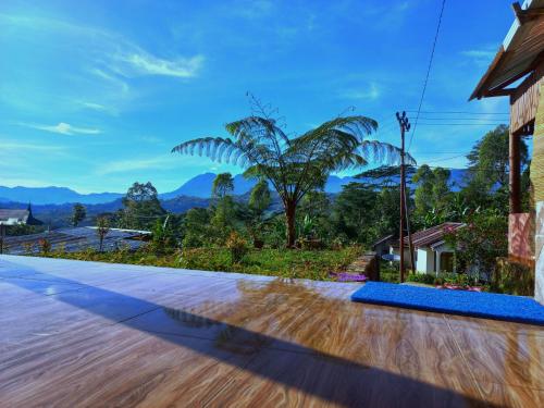 a villa with a view of the mountains at Sun Rice Homestay in Ruteng