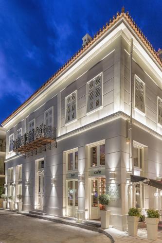 a white building with windows and a balcony at 3 Sixty Hotel & Suites in Nafplio