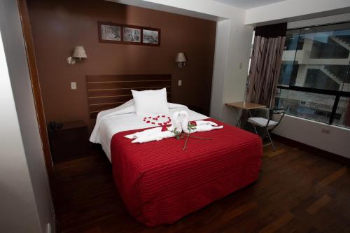 Postel nebo postele na pokoji v ubytování Kapac Inn Hotel