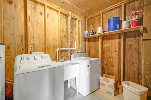 a laundry room with a washer and dryer at Armstrong in Surf City