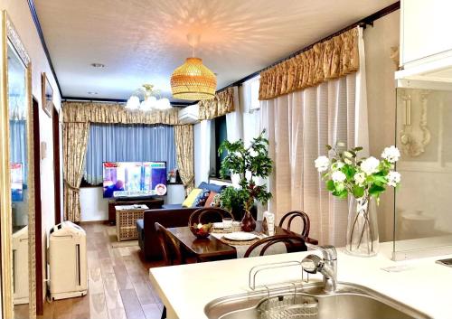 a living room with a couch and a table at Ikebukuro Sta 8 mins Good Access Modern House TS0318 in Tokyo