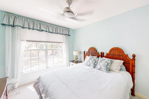 a bedroom with a large bed and a window at Vasari Country Club #201 - Toscana Treasure in Bonita Springs
