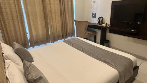 Ein Bett oder Betten in einem Zimmer der Unterkunft K Plus Comforts