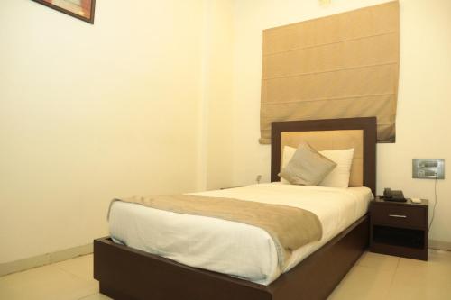 Ein Bett oder Betten in einem Zimmer der Unterkunft K Plus Comforts