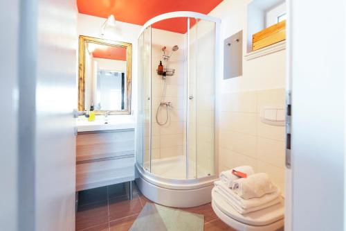 a bathroom with a shower and a toilet at Loreto LYA SEA VIEW APARTMENTS in Rovinj