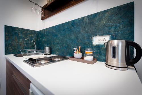 a kitchen with a counter with a tea kettle at Loreto LYA SEA VIEW APARTMENTS in Rovinj