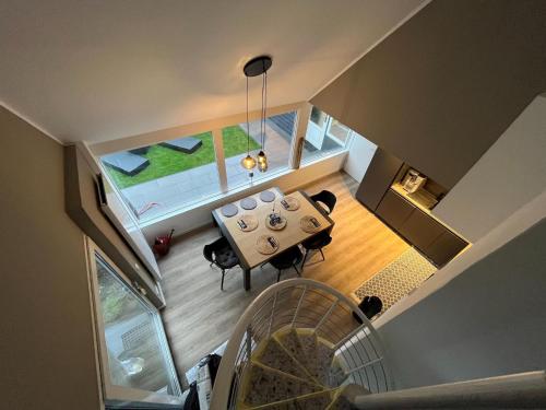 an overhead view of a living room with a table and chairs at Holiday Home Noordwijkerhout by Beach in Noordwijkerhout