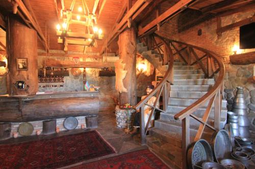 a room with a staircase in a building with pots and pans at Khan Lankaran Hotel in Lankaran