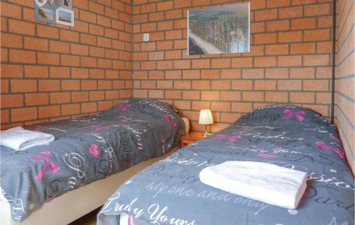 Postel nebo postele na pokoji v ubytování 3 Bedroom Amazing Home In Callantsoog