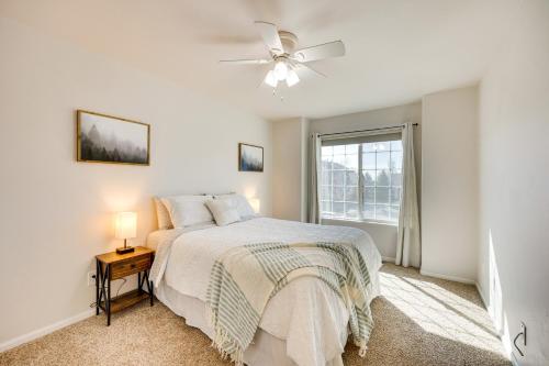 a white bedroom with a bed and a window at Colorado Vacation Rental with Private Hot Tub in Monument