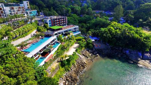 an aerial view of a resort next to a river at Zenmaya Oceanfront Phuket, Trademark Collection by Wyndham in Patong Beach