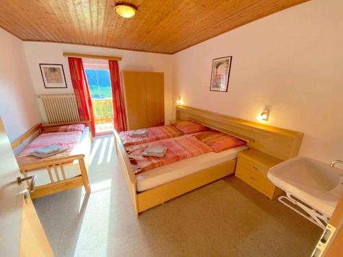 a small bedroom with a bed and a sink at Holiday home in Radstadt - Salzburger Land 352 in Radstadt