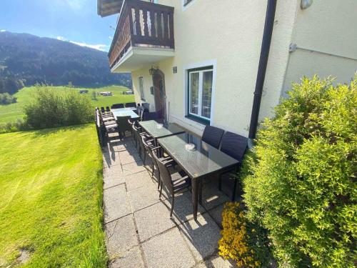 a patio with a table and chairs on a house at Holiday home in Radstadt - Salzburger Land 352 in Radstadt