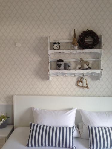 a bedroom with a bed with a shelf above it at Das Ruebezahl in Reit im Winkl
