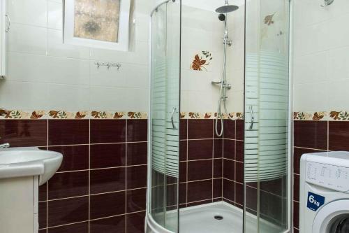a bathroom with a shower and a toilet and a sink at Holiday Homes in Balatonboglar 40843 in Balatonboglár