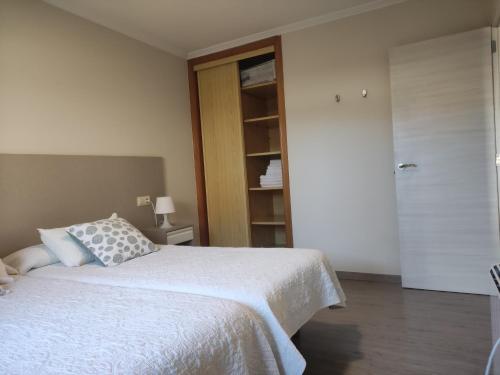 Cama o camas de una habitación en Apartamentos Aqualecer