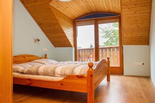 A bed or beds in a room at Holiday home in Balatonmariafürdo 37749
