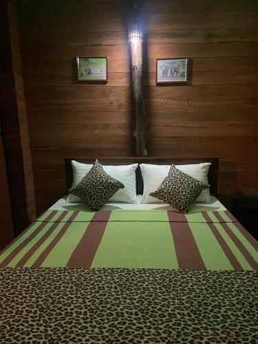 A bed or beds in a room at Yala Wild Safaris Camp