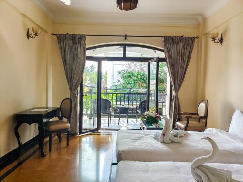 Un ou plusieurs lits dans un hébergement de l'établissement Lagoon Sarovar Premiere Resort - Pondicherry