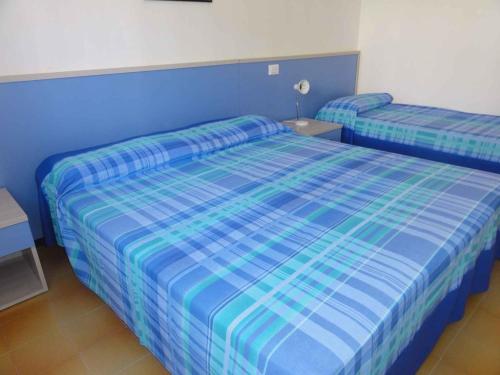 A bed or beds in a room at Holiday home in Bibione 36388