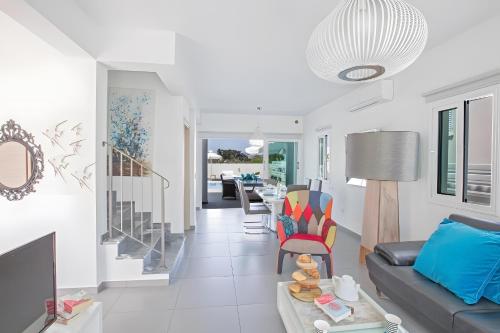 a living room with a couch and a table at Casa de Nicole in Protaras