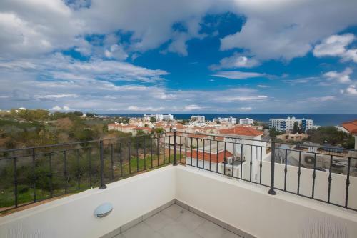 a balcony with a view of the ocean at Casa de Nicole in Protaras