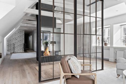 a living room with a glass wall at Villa S:t Hans in Visby