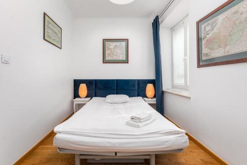 a bedroom with a bed in a room with a map on the wall at Apartament Mariensztat by Your Freedom in Warsaw
