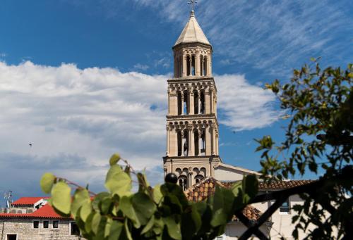 a tall clock tower on top of a building at Slavija Culture Heritage Hotel in Split