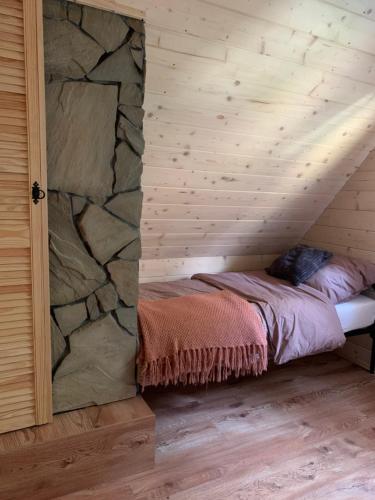 Postel nebo postele na pokoji v ubytování Domek pod smrekami