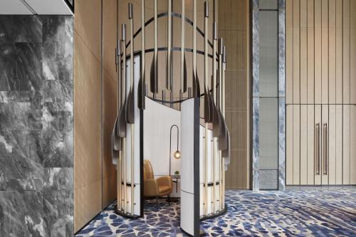 a rendering of a lobby with a chandelier at JW Marriott Shanghai Fengxian in Shanghai