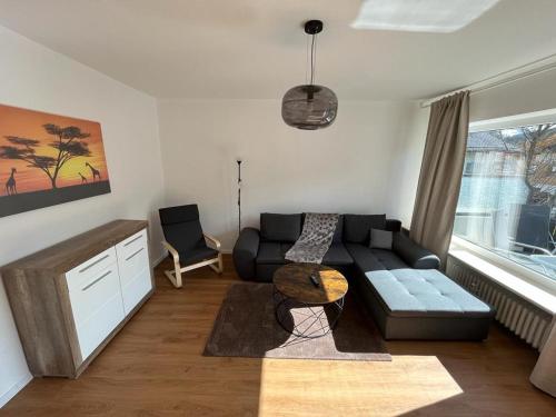 a living room with a couch and a table at Ferienhaus Butterfly 2 in Garmisch-Partenkirchen
