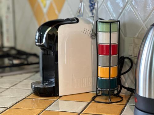 a toaster sitting on a kitchen counter next to a candle at Villa la Milanina in Lipari