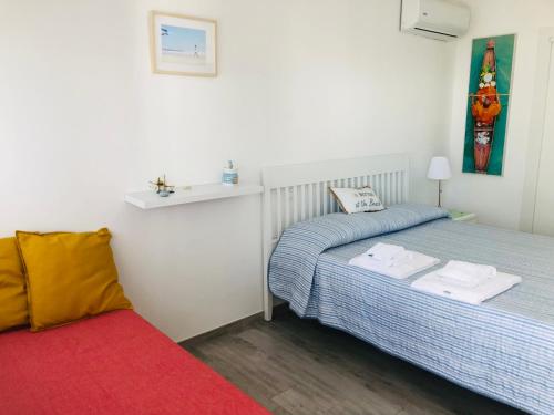 a bedroom with two beds and a sink in it at Case vacanze I trabocchi in San Vito Chietino