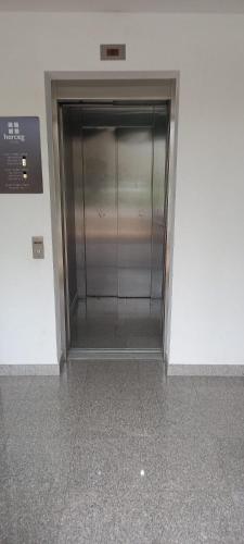 a elevator in a building with a glass door at Marys Home Apartment Međugorje in Međugorje