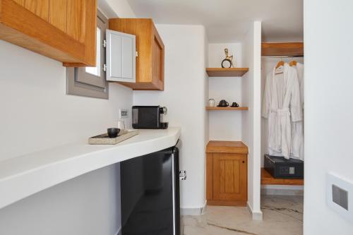 Η κουζίνα ή μικρή κουζίνα στο Allure Breeze Suites