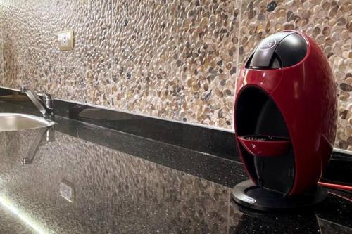 a toaster sitting on a counter next to a sink at Luxury Getaway /Brand New 2BR /Wi-Fi /Full Kitchen in Sharm El Sheikh