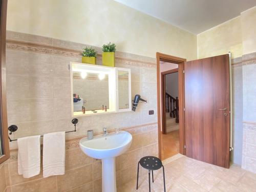 a bathroom with a sink and a mirror at Maison Soleil Guest House Gallipoli in Gallipoli