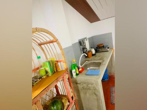 a kitchen with a sink and a counter at Vinu’s Place in Matara
