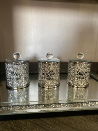 four silver containers sitting on a metal tray at Skye Breaks in Sheerness