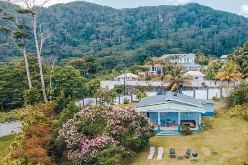an aerial view of a house on a hill at Villa Mille Soleil in Port Glaud