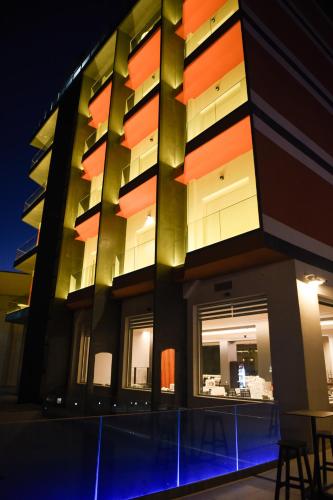 a building with a table in front of it at Olivia's Hill Resort in Durrës