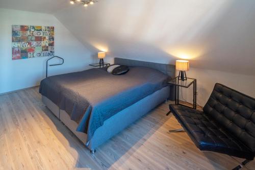 Postel nebo postele na pokoji v ubytování Ferienhaus Wassermann Norddeich