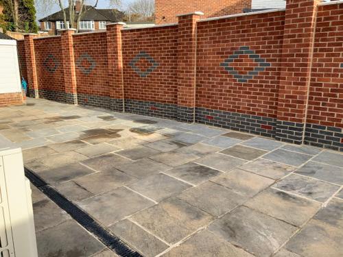 a patio in front of a brick fence at London Road in Earley