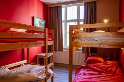 a room with two bunk beds and a window at A l'ombre de la Croisette - Esc'Appart in Dinant