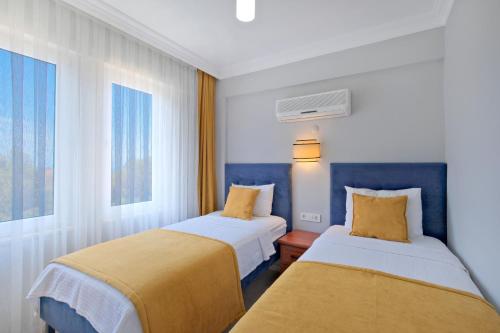 Katil atau katil-katil dalam bilik di Gold Lion Apart Hotel